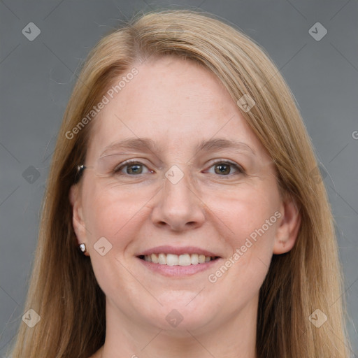 Joyful white adult female with long  brown hair and grey eyes