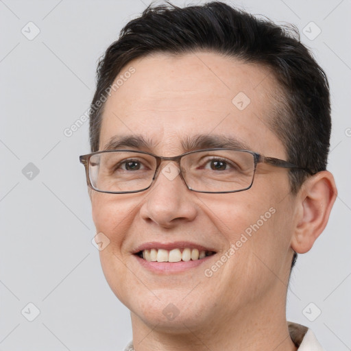 Joyful white adult male with short  brown hair and brown eyes