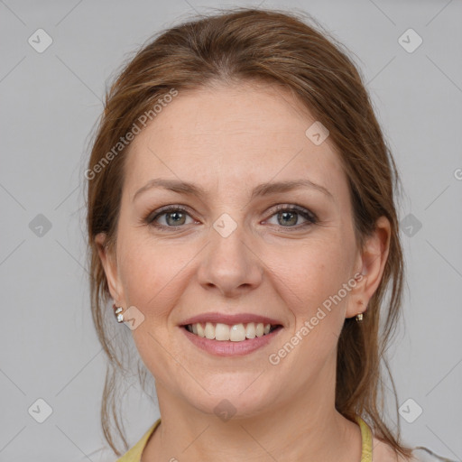 Joyful white young-adult female with medium  brown hair and grey eyes