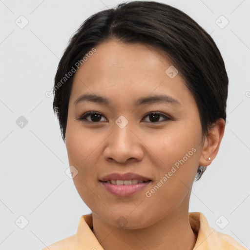 Joyful asian young-adult female with short  brown hair and brown eyes