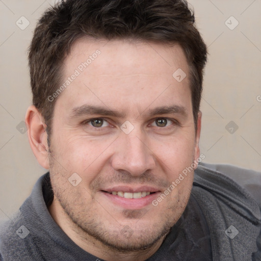 Joyful white adult male with short  brown hair and grey eyes