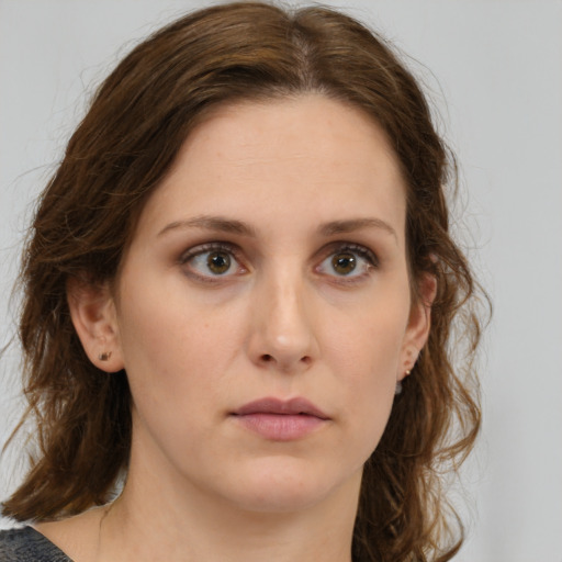 Neutral white young-adult female with medium  brown hair and green eyes