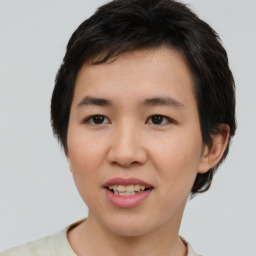 Joyful asian young-adult female with short  brown hair and brown eyes