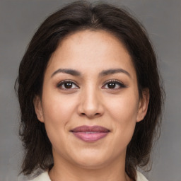 Joyful white young-adult female with medium  brown hair and brown eyes