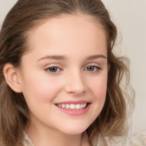 Joyful white child female with medium  brown hair and brown eyes