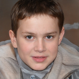 Joyful white child male with short  brown hair and brown eyes