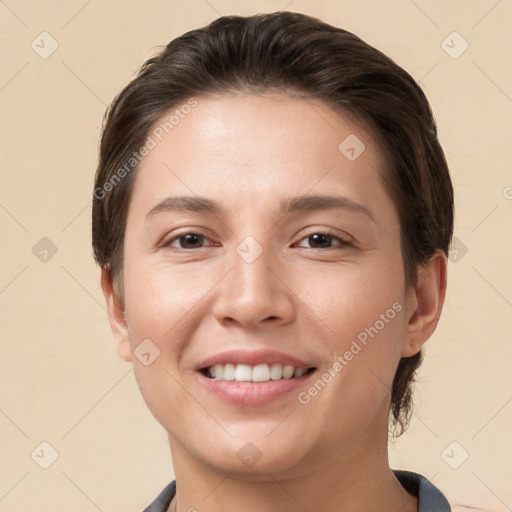 Joyful white young-adult female with short  brown hair and brown eyes