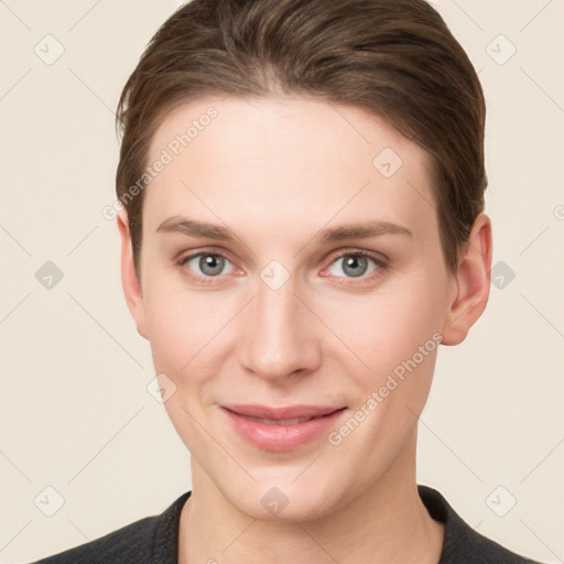 Joyful white young-adult female with short  brown hair and grey eyes