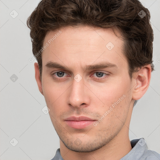 Neutral white young-adult male with short  brown hair and grey eyes