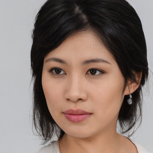 Neutral asian young-adult female with medium  brown hair and brown eyes