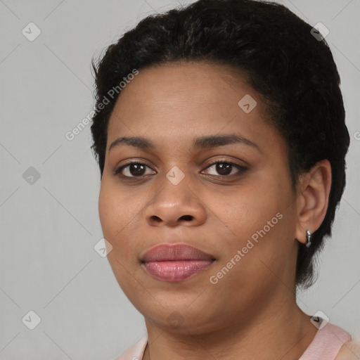 Joyful black young-adult female with short  black hair and brown eyes