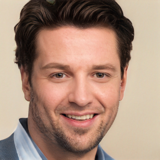 Joyful white adult male with short  brown hair and brown eyes