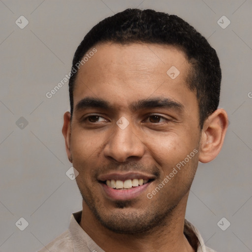 Joyful latino young-adult male with short  black hair and brown eyes