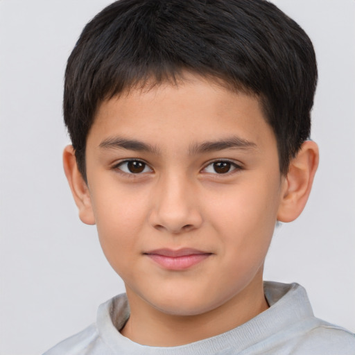 Joyful white child male with short  brown hair and brown eyes