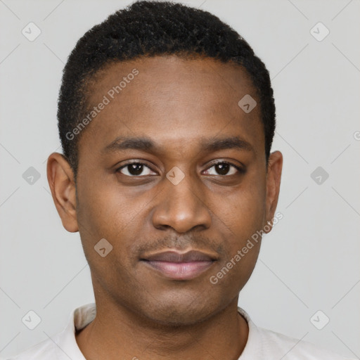 Joyful black young-adult male with short  brown hair and brown eyes