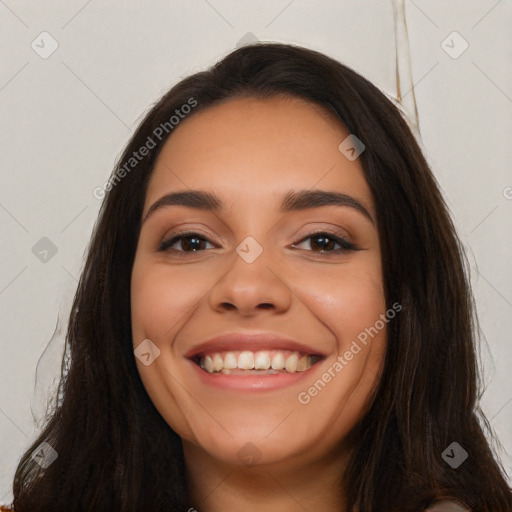 Joyful white young-adult female with long  black hair and brown eyes