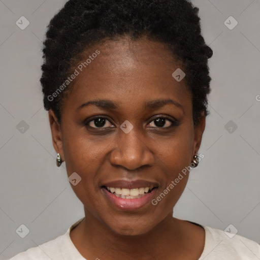 Joyful black young-adult female with short  black hair and brown eyes