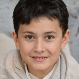 Joyful white child male with short  brown hair and brown eyes