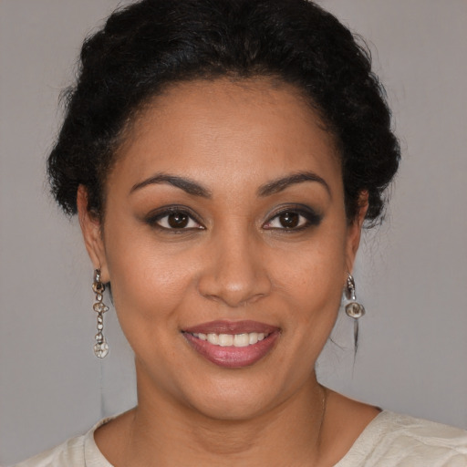 Joyful latino young-adult female with short  brown hair and brown eyes