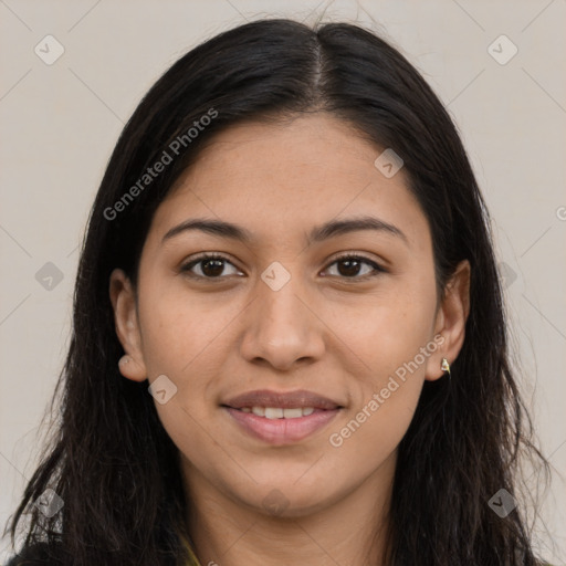 Joyful latino young-adult female with long  brown hair and brown eyes