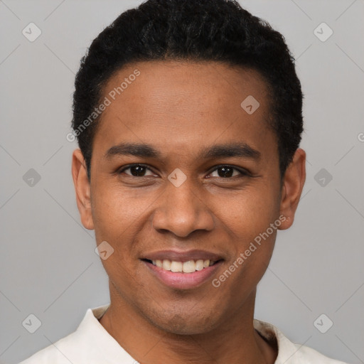 Joyful black young-adult male with short  black hair and brown eyes