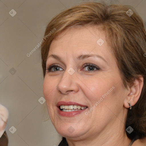 Joyful white adult female with medium  brown hair and brown eyes