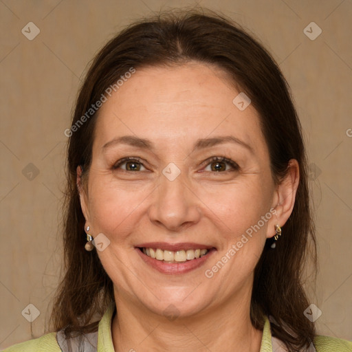 Joyful white adult female with medium  brown hair and grey eyes