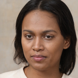 Joyful asian young-adult female with long  brown hair and brown eyes