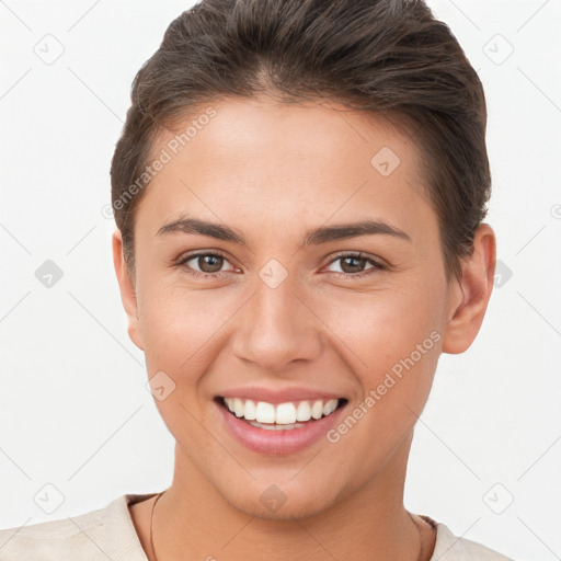 Joyful white young-adult female with short  brown hair and brown eyes