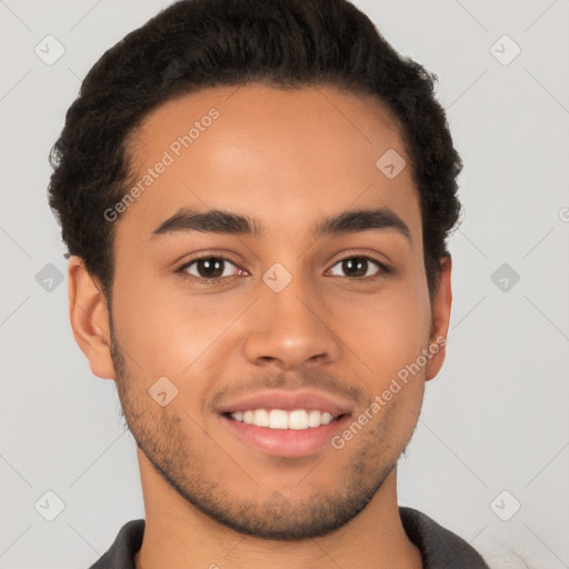 Joyful latino young-adult male with short  brown hair and brown eyes