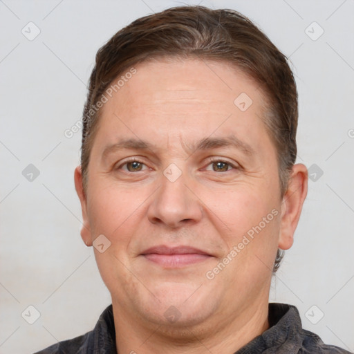 Joyful white adult male with short  brown hair and brown eyes