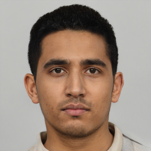 Neutral latino young-adult male with short  black hair and brown eyes