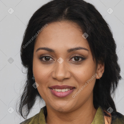 Joyful black adult female with medium  brown hair and brown eyes