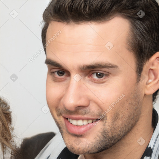 Joyful white young-adult male with short  brown hair and brown eyes