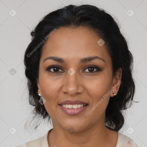 Joyful latino adult female with medium  brown hair and brown eyes