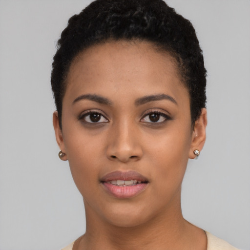 Joyful latino young-adult female with short  black hair and brown eyes