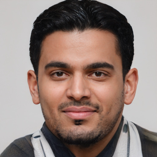 Joyful latino young-adult male with short  black hair and brown eyes