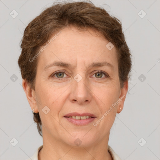 Joyful white adult female with short  brown hair and grey eyes