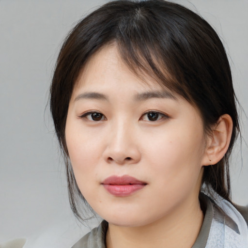 Neutral asian young-adult female with medium  brown hair and brown eyes