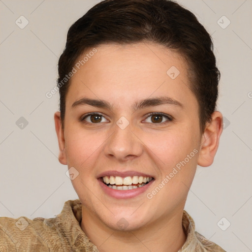 Joyful white young-adult female with short  brown hair and brown eyes