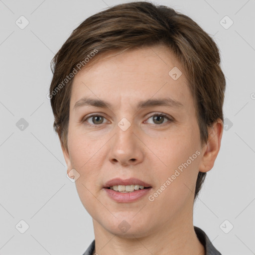 Joyful white young-adult female with short  brown hair and grey eyes