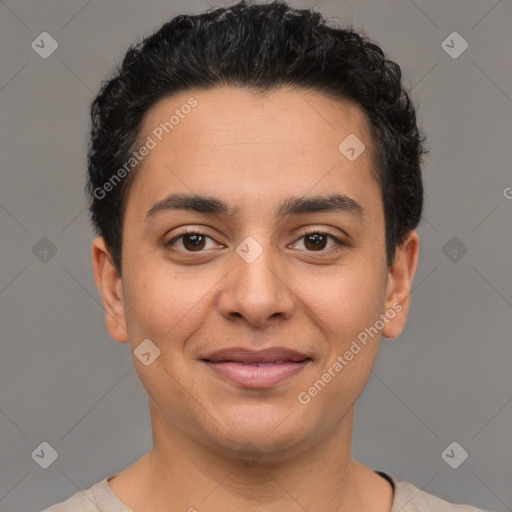 Joyful latino young-adult male with short  brown hair and brown eyes