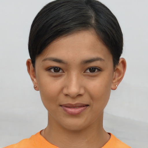 Joyful asian young-adult female with short  brown hair and brown eyes