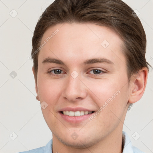 Joyful white young-adult female with short  brown hair and grey eyes