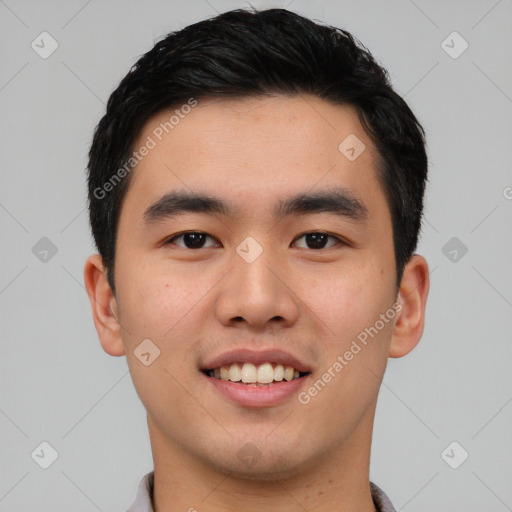 Joyful asian young-adult male with short  black hair and brown eyes