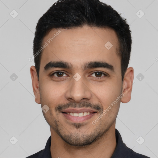 Joyful white young-adult male with short  black hair and brown eyes