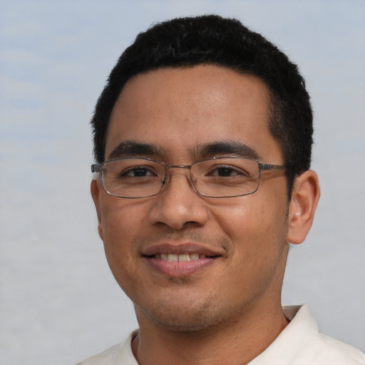 Joyful asian young-adult male with short  black hair and brown eyes