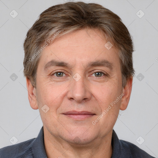 Joyful white adult male with short  brown hair and grey eyes