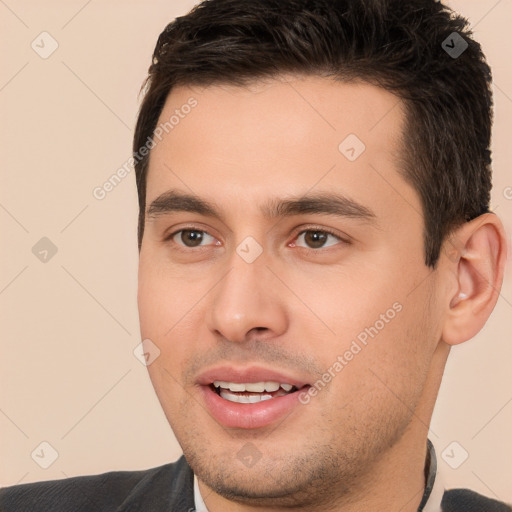 Joyful white young-adult male with short  brown hair and brown eyes