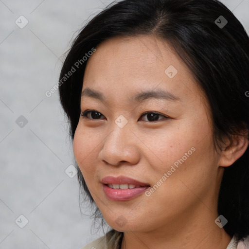 Joyful asian young-adult female with medium  brown hair and brown eyes